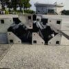A group of metal pieces laying on the ground.