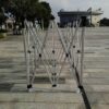 A group of metal poles on a concrete floor.