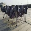 A group of chairs with umbrellas on top of them.