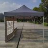 Outdoor pop up tent with two windows.
