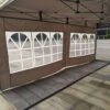 A tent with two windows on the side.