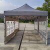 Outdoor pop up tent with windows.