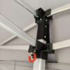 A metal pole with a red and white handle.