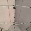 A tent with a metal pole and a metal pole.