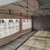 A tent with a large window on the side.