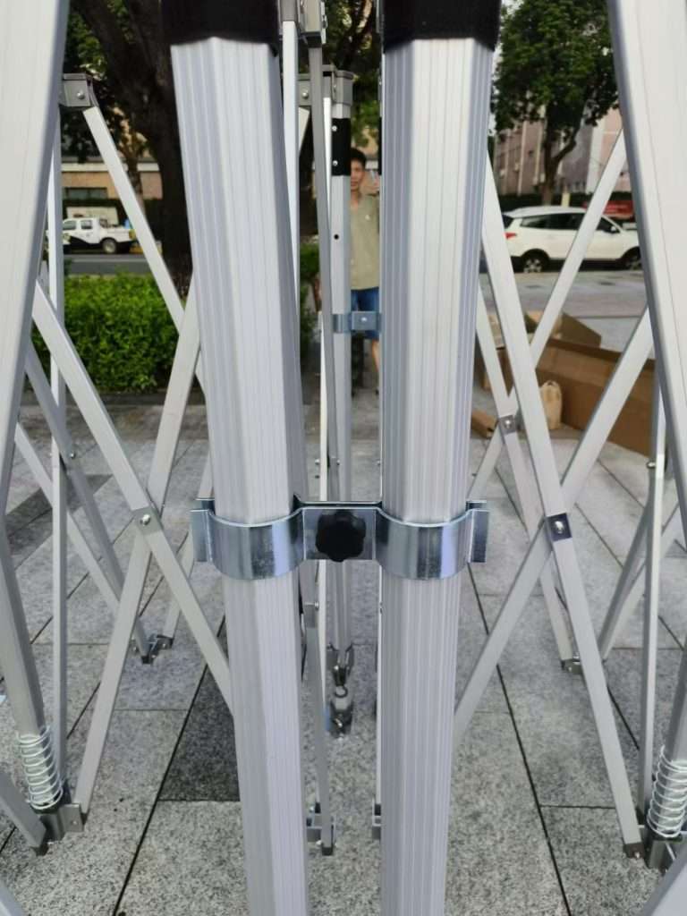A set of four metal poles with a white background.