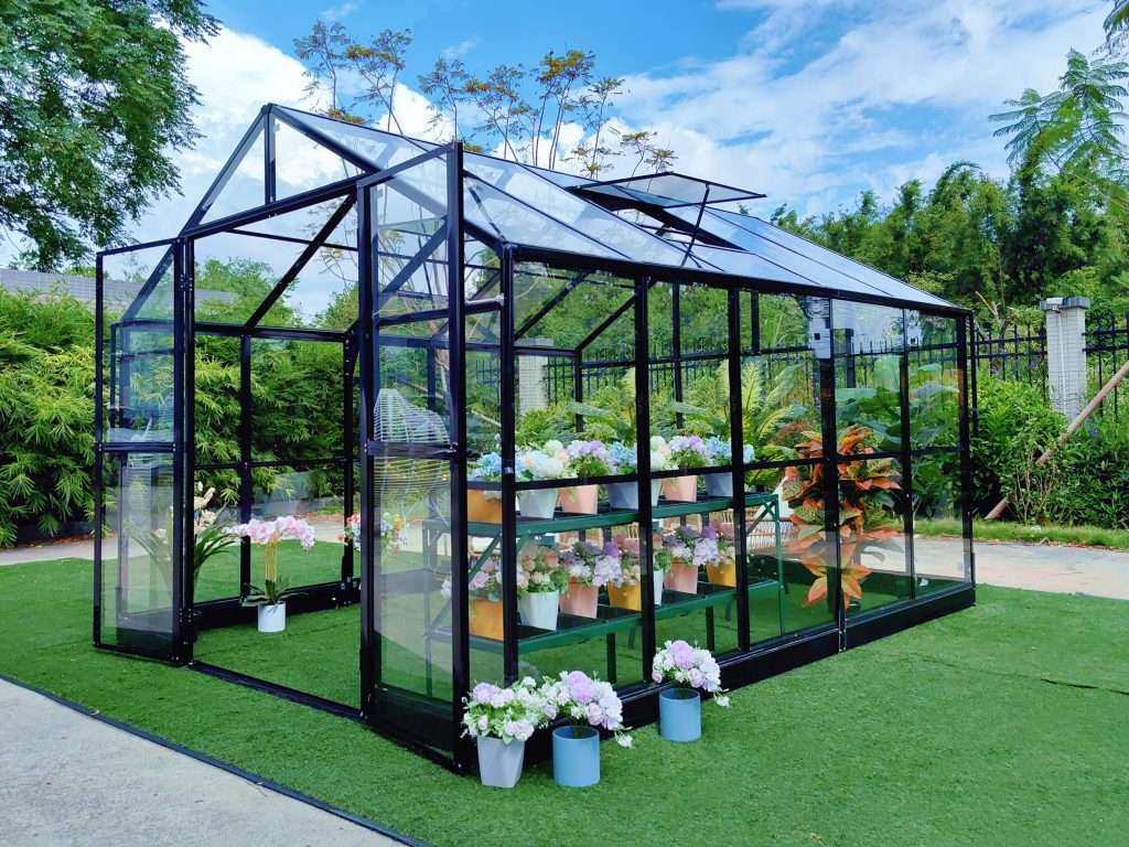 A greenhouse with flowers and plants in it.