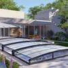 A modern home with a glass roof and patio. Poly bassengoverbygg 5x10 meter
