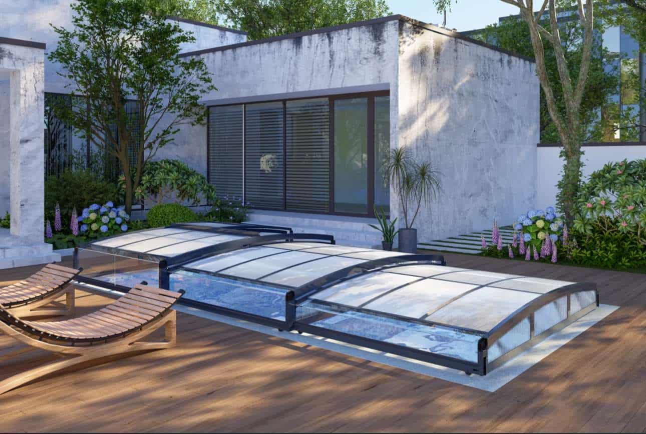 A glass enclosed pool with wooden decking. Poly bassengoverbygg 3x6 meter