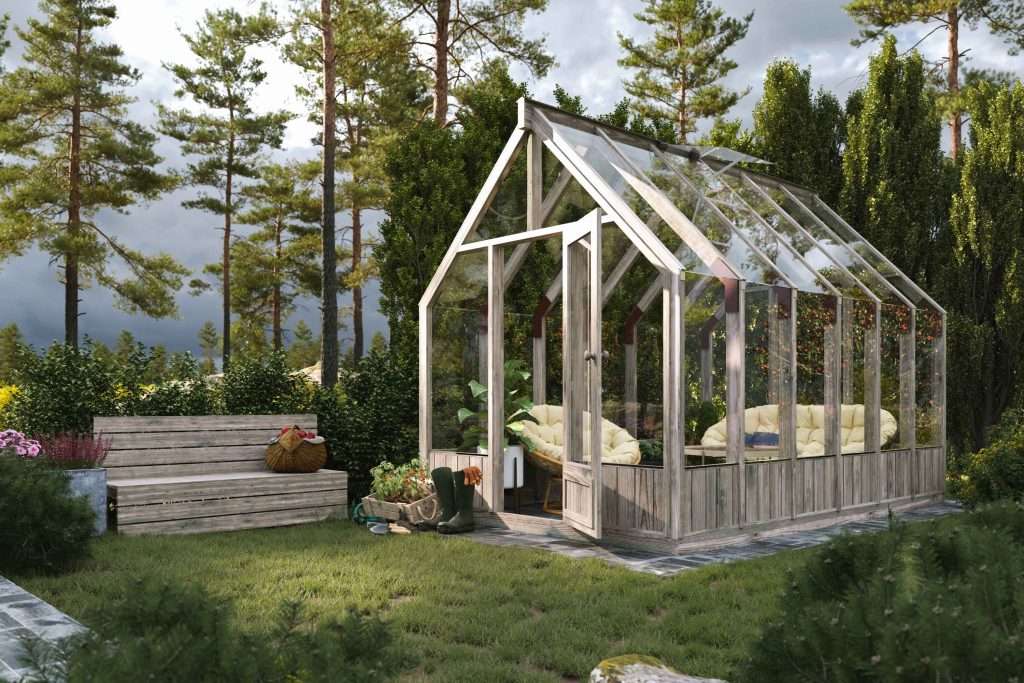 A small greenhouse with a bench and a bench.